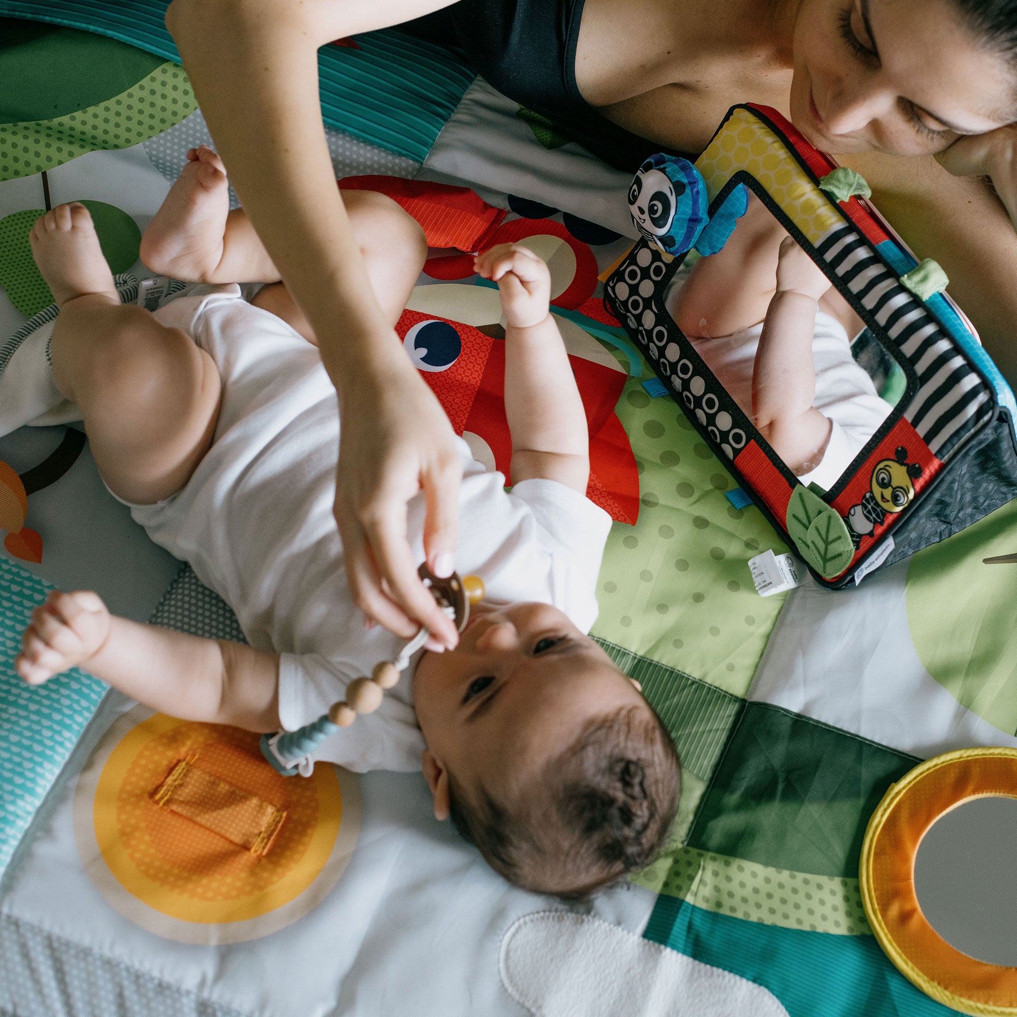Mother and baby playing while laying down